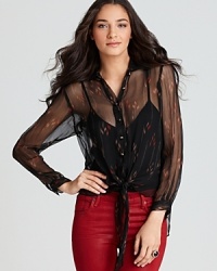 Exude chic allure with this Akiko sheer top finished in a pretty print. Pair with colored denim for on-trend style. Exude chic allure with this Akiko sheer top finished in a pretty print. Pair with colored denim for on-trend style.