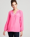 Add a hard hit of hue to your daily repertoire with this silk Lilly Pulitzer blouse, guaranteed to amp up sleek denim just as well as polished pencil skirts.