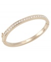 Go for the gold with this sparkling bangle by Carolee. Bracelet crafted in gold tone mixed metal with set glass stones and hinge closure. Approximate diameter: 2-1/4 inches x 1-7/8 inches.
