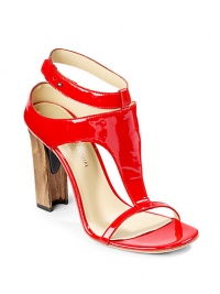 THE LOOKPatent leather T-strapAdjustable ankle strap with stud closurePadded insolePlastic and wooden heel, 4 (100mm)THE MATERIALPatent leather upperLeather lining and soleORIGINMade in Italy THE LOOKPatent leather T-strapAdjustable ankle strap with stud closurePadded insolePlastic and wooden heel, 4 (100mm)THE MATERIALPatent leather upperLeather lining and soleORIGINMade in Italy