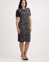 An undeniable head turner, this jersey dress features a zebra-print front. A touch of stretch ensures that you will love the way it fits you.Feminine necklineShort sleevesPrinted frontPull-on stylePrincess seams on backAbout 24 from natural waist95% wool/3% polyester/2% Lycra®Dry cleanMade in Italy