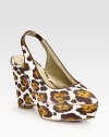A leopard print lends fierce style to this slingback pump in rich Italian canvas, heightened by a sturdy wedge. Self-covered wedge, 4 (100mm)Covered platform, 1½ (40mm)Compares to a 2½ heel (65mm)Canvas upper with faux leather trimPoint toeElasticized slingback strapFaux leather lining and solePadded insoleMade in Italy