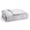Delicate floral vines wind across solid cotton jacquard on duvets and shams in this luxe collection by Vera Wang.