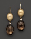Faceted smoky quartz ovals, set in 14K yellow gold.