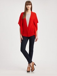Long, cape-like cardigan of pure cashmere has a plunging v-neck, hidden button front and elbow-length sleeves. V-neckElbow-length cape sleevesHidden button frontAbout 22 from natural waistCashmereDry cleanImportedModel shown is 5'10 (177cm) wearing US size Small. Long, cape-like cardigan of pure cashmere has a plunging v-neck, hidden button front and elbow-length sleeves. V-neckElbow-length cape sleevesHidden button frontAbout 22 from natural waistCashmereDry cleanImportedModel shown is 5'10 (177cm) wearing US size Small.