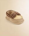 You'll love this adorable pair of boat shoes on your little sailor in plush leather and sheepskin.Slip-on styleSuede upperLeather and sheepskin liningLeather solePadded insoleImported