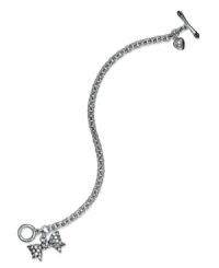 A beauty wrapped in bows. This toggle bracelet from Juicy Couture pretties up your look with bow and heart pendants embellished with shimmering pave accents. Crafted in silver tone mixed metal. Approximate length: 7-1/2 inches. Approximate drop length: 1-1/2 inches. A beauty wrapped in bows. This toggle bracelet from Juicy Couture pretties up your look with bow and heart pendants embellished with shimmering pave accents. Crafted in silver tone mixed metal. Approximate length: 7-1/2 inches. Approximate drop length: 1-1/2 inches.