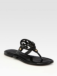Oversized designer emblem defines this patent leather thong design. Patent leather upperLeather liningRubber solePadded insoleImportedOUR FIT MODEL RECOMMENDS ordering one half size down as this style runs large. Oversized designer emblem defines this patent leather thong design. Patent leather upperLeather liningRubber solePadded insoleImportedOUR FIT MODEL RECOMMENDS ordering one half size down as this style runs large.