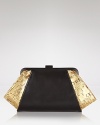 Z Spoke Zac Posen takes the textured trend out for the night with this clutch, coolly crafted of leather with cork trims. Carry it to send a mixed material message.