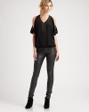 Sprinkled in soft leather embellishments, this pure silk top has split flutter sleeves and an elasticized hem for a tailored fit. Leather-trim v-neckSplit flutter sleevesElasticized hemBody: SilkTrim: LeatherDry clean with leather specialistImportedModel shown is 5'10 (177cm) wearing US size Small.