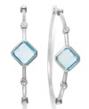 Classic earrings get a sparkly update. Victoria Townsend's stunning hoop earrings feature square-cut blue topaz (6-1/2 ct. t.w.) and sparkling diamond accents in sterling silver. Approximate diameter: 2 inches.