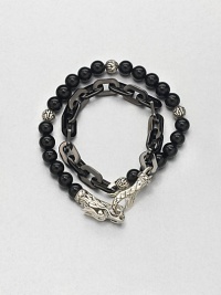 Double-strand beaded and link bracelet of sterling silver and black onyx is offset by an engraved lobster clasp.Sterling silver/stainless steelBlack onyxAbout 3 diam.Imported