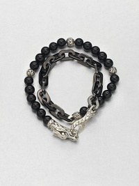 Double-strand beaded and link bracelet of sterling silver and black onyx is offset by an engraved lobster clasp.Sterling silver/stainless steelBlack onyxAbout 3 diam.Imported Double-strand beaded and link bracelet of sterling silver and black onyx is offset by an engraved lobster clasp.Sterling silver/stainless steelBlack onyxAbout 3 diam.Imported