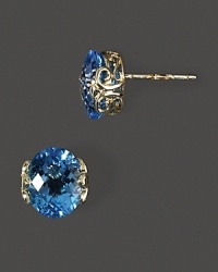 Faceted blue topaz in intricate 14K yellow gold settings. Faceted blue topaz in intricate 14K yellow gold settings.