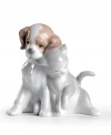 Everyone needs someone to love, even if that someone has fleas. The lifelike expressions of this smooth porcelain cat and dog duo give way to a patient and tender love story. 4.75 x 4.25.