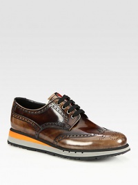 A sleek, yet sporty rendition of the classic oxford, crafted from calfskin leather with a striped sole.Leather upperLeather liningRubber soleImported A sleek, yet sporty rendition of the classic oxford, crafted from calfskin leather with a striped sole.Leather upperLeather liningRubber soleImported
