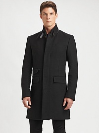 A classic overcoat is tailored with modern proportions from fine Italian wool, highlighting a sleek, streamlined silhouette and a removable nylon vest for long-lasting style, warmth and versatility.Button-frontStand collarChest welt, waist flap pocketsRear ventFully linedAbout 39 from shoulder to hemWoolDry cleanImported