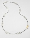 Hammered sterling silver and 24k gold swirl stations on a long, delicate link chain. Sterling silver24k goldLength, about 41.7Slip-on styleImported 