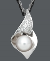 Smooth, delicate, and elegant. This timeless style combines a shimmery cultured freshwater pearl (7-8 mm), sparkling diamond accents and a sterling silver setting. Approximate length: 18 inches. Approximate drop: 9/10 inch. Smooth, delicate, and elegant. This timeless style combines a shimmery cultured freshwater pearl (7-8 mm), sparkling diamond accents and a sterling silver setting. Approximate length: 18 inches. Approximate drop: 9/10 inch.
