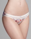 Match your sweet side in a pretty floral printed bikini from Calvin Klein.