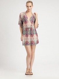 The pretty print gives this pull-on coverup an exotic look. The drawstring waist creates a flattering silhouette.V-neckFlutter sleevesDrawstring waistCord ends95% polyester/5% spandexHand washImported The pretty print gives this pull-on coverup an exotic look. The drawstring waist creates a flattering silhouette.V-neckFlutter sleevesDrawstring waistCord ends95% polyester/5% spandexHand washImported