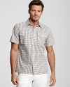 A cool, crisp shirt in checks brings a touch of color and texture to your warm-weather look.