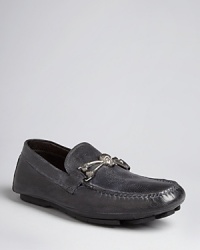 Rock these edgy pebbled leather driving loafers, featuring a skull and bone bit across the tongue, whenever you need a little extra verve. Utterly comfortable with a lining that molds to your feet, they make a solid addition to your casual cool shoe wardrobe. Rock these edgy pebbled leather driving loafers, featuring a skull and bone bit across the tongue, whenever you need a little extra verve. Utterly comfortable with a lining that molds to your feet, they make a solid addition to your casual cool shoe wardrobe.