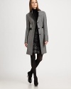 Contrast details add a sleek finish to this architectural wool coat. Contrast stand collarBreast welt pocketButton frontAttached belt detailFaux leather trimAbout 35 from shoulder to hemWoolDry cleanImportedModel shown is 5'11 (180cm) wearing US size 4. 