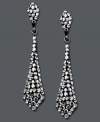 It's a black tie affair. Kaleidoscope's elegant tie-shaped drop earrings shine feature round-cut smokey crystals. Set in sterling silver with Swarovski elements. Approximate drop: 1-1/2 inches.