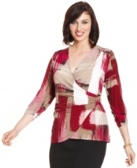 Liven up your neutral bottoms with Alfani's three-quarter-sleeve plus size top, featuring a flattering faux wrap design. Liven up your neutral bottoms with Alfani's three-quarter-sleeve plus size top, featuring a flattering faux wrap design.