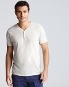 A linen and cotton blend create a naturally flowing drape to the v neck cotton henley.