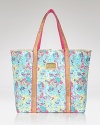 Your passport to style, this Lilly Pulitzer tote travels through time with a sparkling print saluting decades of design.