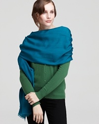 Whether it's wrapped around your shoulders or tied at the neck, this versatile wrap is a must-have for the chilly season. Whether it's wrapped around your shoulders or tied at the neck, this versatile wrap is a must-have for the chilly season.