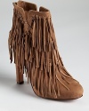 Tiers of fringe trickle down Jean-Michel Cazabat's Pepe boots--part western, part bohemian.