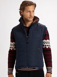 A cold weather layering favorite is expertly crafted and lined with superior down fill for exceptional warmth.Zip frontStand collarChest, waist zip pocketsFully linedAbout 26 from shoulder to hemPolyesterDry cleanImported A cold weather layering favorite is expertly crafted and lined with superior down fill for exceptional warmth.Zip frontStand collarChest, waist zip pocketsFully linedAbout 26 from shoulder to hemPolyesterDry cleanImported