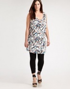A festive print meets a design offering classic, draped details. This will be a figure-flattering tunic that you will love to wear with skinny jeans or leggings. Draped necklineSleevelessAllover printSelf-tie detail at backPull-on style About 37 from shoulder to hem94% venezia/6% spandexDry cleanMade in USA