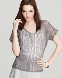 This Eileen Fisher staple will slip seamlessly into your summer wardrobe. A delicate knit pairs with a subdued gray for easy sophistication. This Eileen Fisher staple will slip seamlessly into your summer wardrobe. A delicate knit pairs with a subdued gray for easy sophistication.
