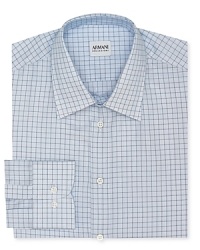 This refreshingly graphic take on a classic windowpane check shirt offers a contemporary fit in superior Italian cotton for a truly refined masterpiece from Armani Collezioni. This refreshingly graphic take on a classic windowpane check shirt offers a contemporary fit in superior Italian cotton for a truly refined masterpiece from Armani Collezioni.