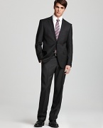 A gallant suit in season-spanning wool cuts a handsome figure whether you wear it to the office, as a wedding guest or to your off-hours evening affairs. Featuring a slimmer fit for modern appeal.