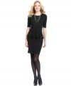 NY Collection's little black dress looks lavish with a pop of peplum at the waist.