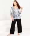 Embrace the beautiful prints of One World's plus-size Black Tears pajamas set. The top features a v-neck, while the roomy pants feature a comfy elastic waistband.