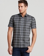 Add plaid to your handsome, casual cool wardrobe in this sharp short-sleeve button-down from the renowned designer HUGO.