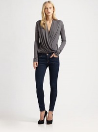 Stand out in the crowd with this elegantly draped jersey top, defined by a crossover v-neck that creates a wrap-like effect. Crossover v-neckLong sleevesElasticized hemModalDry cleanMade in USAModel shown is 5'11 (180cm) wearing US size Small. Stand out in the crowd with this elegantly draped jersey top, defined by a crossover v-neck that creates a wrap-like effect. Crossover v-neckLong sleevesElasticized hemModalDry cleanMade in USAModel shown is 5'11 (180cm) wearing US size Small.