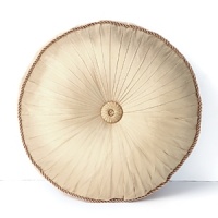 Boasting a classically opulent shape in finely pleated camel colored sateen, this Waterford decorative pillow boasts fine twisted cord piping and a center adornment. Boasting a classically opulent shape in finely pleated camel colored sateen, this Waterford decorative pillow boasts fine twisted cord piping and a center adornment.