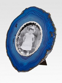 This large, luxurious statement piece frames your photographs first with an organic sterling silver surround, and then the natural patterns and shapes of the stone itself.9 diam.Accomodates a 4 X 6 photoFabric easelSterling silver front and backAgateImportedPlease note that as this is a natural product, stones may vary. This large, luxurious statement piece frames your photographs first with an organic sterling silver surround, and then the natural patterns and shapes of the stone itself.9 diam.Accomodates a 4 X 6 photoFabric easelSterling silver front and backAgateImportedPlease note that as this is a natural product, stones may vary.