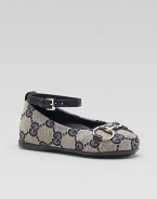 GG print fabric with horsebit detail, leather trim, and ankle strap. Hypoallergenic palladium finished horsebit hardware Slip-on flats with buckle ankle strap Rubber sole Made in Italy