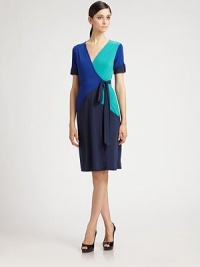 Universally flattering, a jersey wrap dress that features colorblocking, one of this season's hottest trends.V-necklineButton-tab sleevesWrap-front designAbout 25 from natural waist94% polyester/6% spandexDry cleanImportedModel shown is 5'11 (180cm) wearing US size Small. Universally flattering, a jersey wrap dress that features colorblocking, one of this season's hottest trends.V-necklineButton-tab sleevesWrap-front designAbout 25 from natural waist94% polyester/6% spandexDry cleanImportedModel shown is 5'11 (180cm) wearing US size Small.