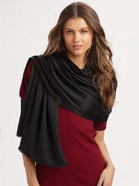 Hand-woven and hand-dyed cashmere/silk wrap reverses from a matte to a shine. Woven satin ball fringe 78L X 22W Imported