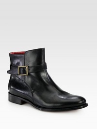 Supple leather forms this on-trend silhouette with a logo-detailed buckle strap. Stacked heel, 1 (25mm)Leather upperPull-on style with adjustable ankle strapLeather lining and solePadded insoleMade in Italy Supple leather forms this on-trend silhouette with a logo-detailed buckle strap. Stacked heel, 1 (25mm)Leather upperPull-on style with adjustable ankle strapLeather lining and solePadded insoleMade in Italy