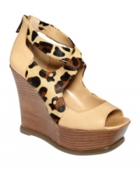 Crisscrossed at the ankle with cute leopard straps, Jessica Simpson's Leeza platform wedges mix animal print, pretty neutrals, and towering wedges for a look that's sure to make your outfit really pop.